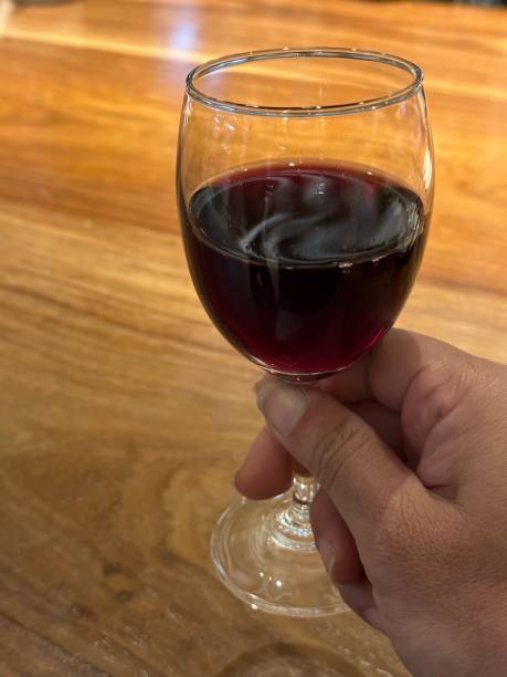 istock A hand holding a glass of wine 1474094314