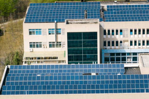 istock Aerial view of solar panels on building rooftop 1474097609