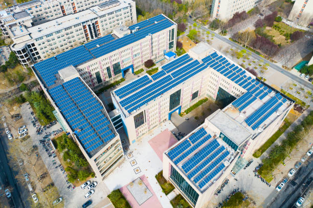 istock Solar power panels on top of building 1474097702