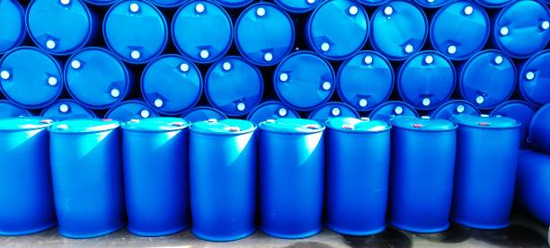istock Blue plastic drums are arranged in an orderly manner in the outer warehouse 1474100609