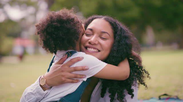 Mother, girl and park hug with happiness, bonding and mama love outdoor with a child. Smile, family and parent support with a black woman and kid together with blurred background feeling happy