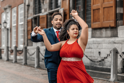 Stylish mixed race couple dancing in Delft