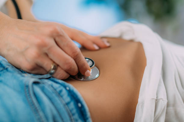istock Gastroenterologist, Pediatrician.  Abdominal Examination with Stethoscope 1474102314