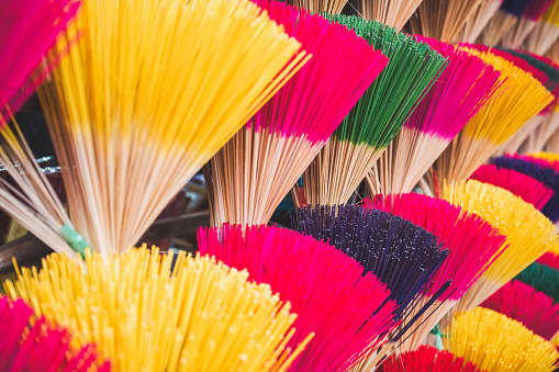 colorful incense sticks in a row at shop in hue, vietnam