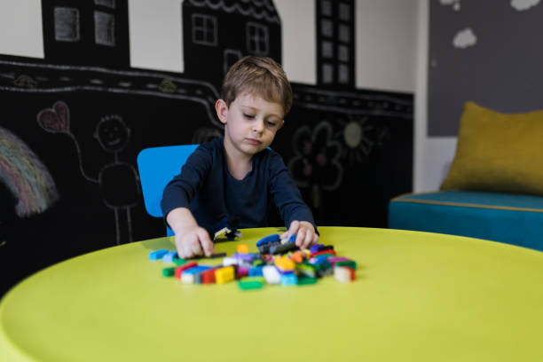 istock Boy playing with colourful educational toy blocks 1474104669