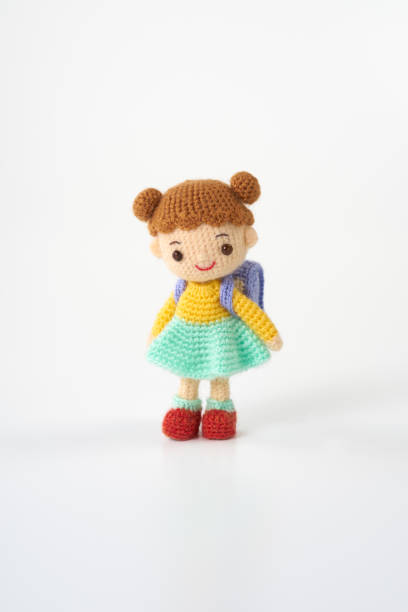 istock Small and cute Amigurumi doll on white background.　school 1474104783