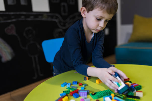 istock Boy playing with colourful educational toy blocks 1474104880