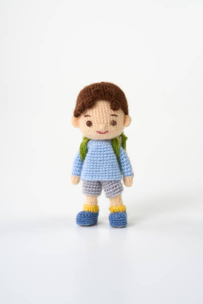 istock Small and cute Amigurumi doll on white background.　school 1474105123