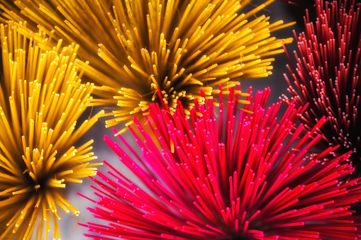 close up of colorful incense sticks