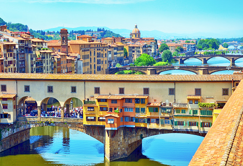 The Ponte Vecchio (Old Bridge) is a Medieval bridge over the Arno River, in Florence, Italy. The bridge first appears in a document of 996