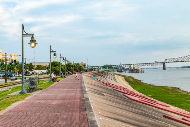 people enjoy sitting at Mississippi promenade in Baton Rouge in the afternoon. stock photo