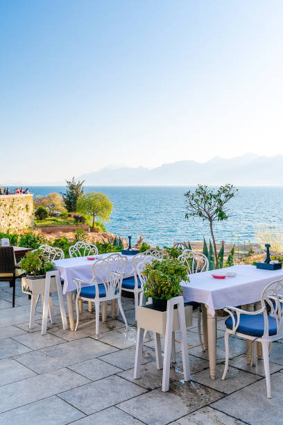 istock A table in a cafe on a rock by the sea. 1474111640