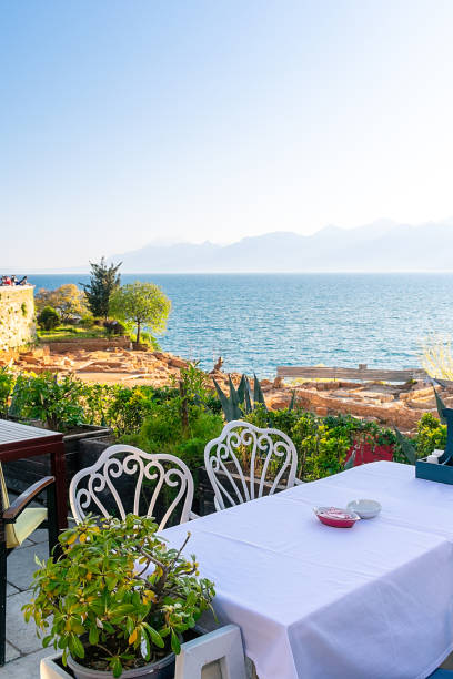 istock A table in a cafe on a rock by the sea. 1474111772