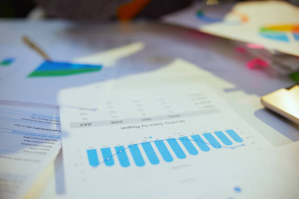 istock business woman working with documents and graphs 1474113185