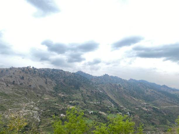 istock Patches of clouds on hilly area 1474115066
