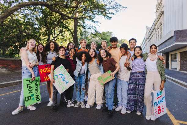 istock Multiethnic young people holding a climate protest 1474115496