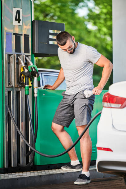 istock Concerned man left without money after spending all on fuel. 1474120317
