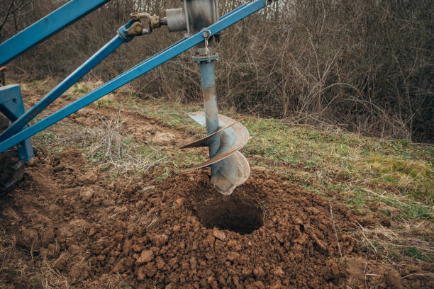 istock Digging a hole in the ground with an outdoor drill 1474120797