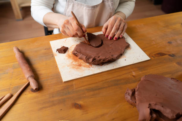 istock Ceramist artist female work in studio 1474121611