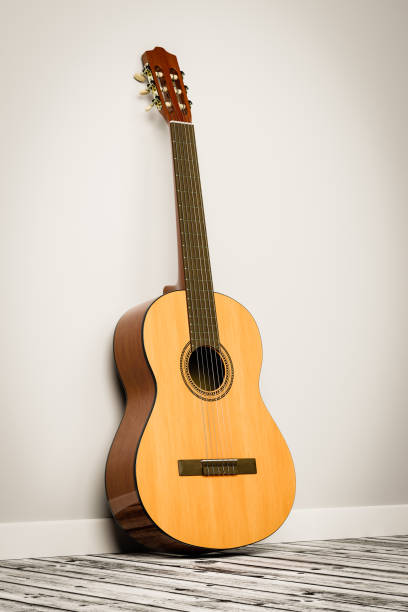 istock Classical Guitar Leaning Against the Wall of a Room 1474122271