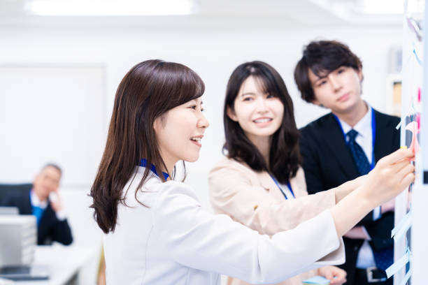 istock Staff enjoying working in the office 1474123311
