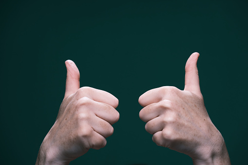 Close-Up Of Human Hand Against White Background