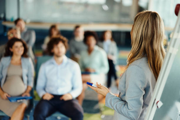 istock Female entrepreneur giving a speech on a seminar. 1474129543