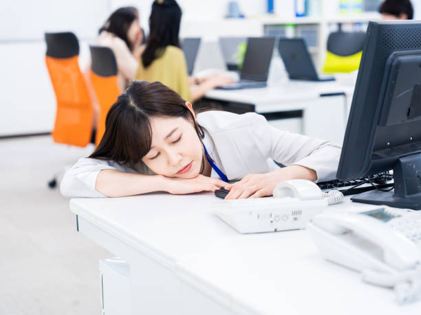 Busy and fatigued businessperson stock photo