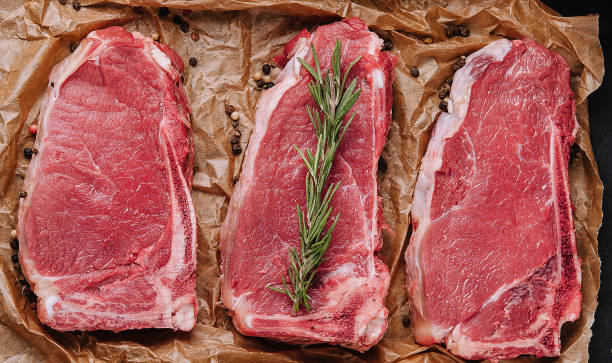 istock Raw strip loin steaks on baking paper 1474130632