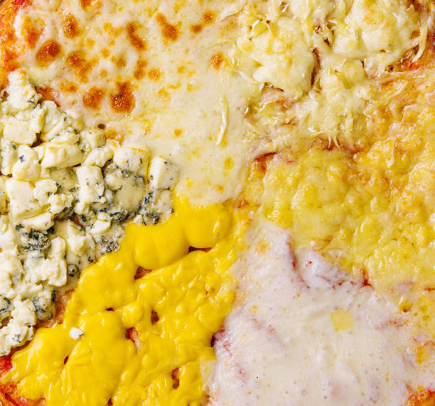 different types of cheese on a big pizza