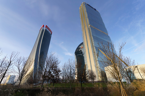 Milan, Italy - January 14, 2023: Citylife, modern park in Milan, Lombardy, Italy, with the Three Towers
