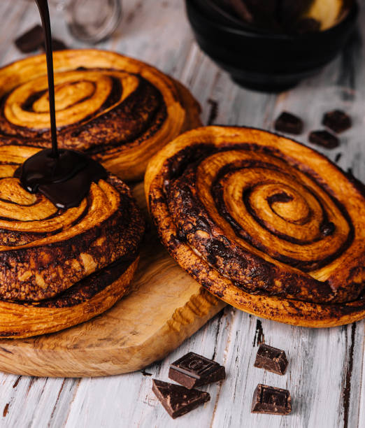 istock sweet chocolate cinnamon rolls on wood 1474132281