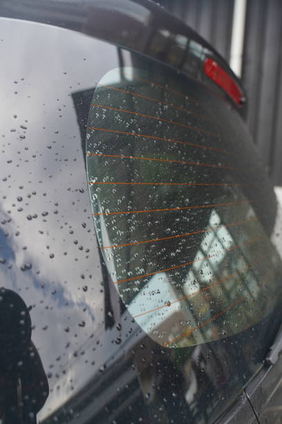istock Raindrops in the black car 1474132284
