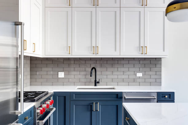 istock A kitchen detail with white and blue cabinets and a subway tile backsplash. 1474133159