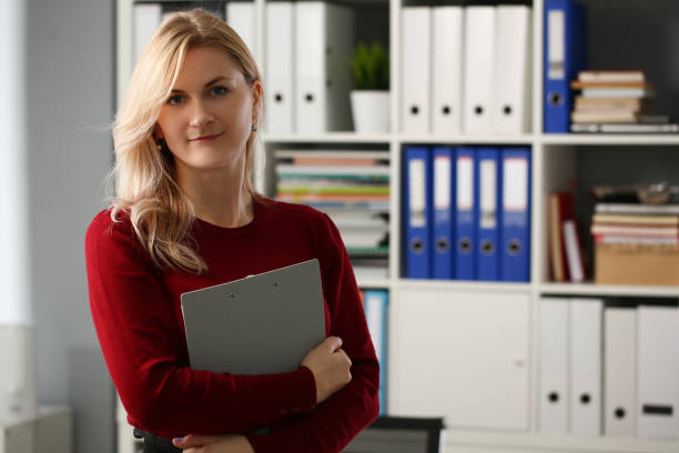 istock Woman secretary manager is holding documents in office 1474133543