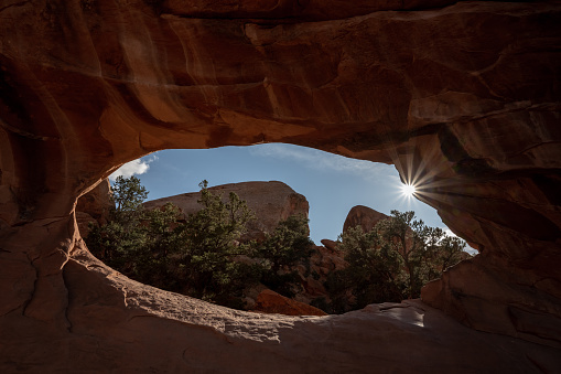 Sun Burst Through The Lower Part of Double O Arch in Arches National Park