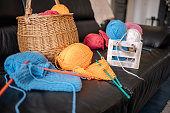 istock Knitting at home in living room 1474136792