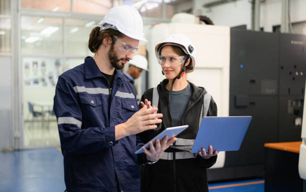 istock Technician engineer team checking and repairing part of automatic machine 1474136806
