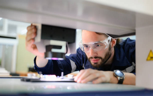 istock Professional engineer checking and repairing part of automatic machine 1474138175