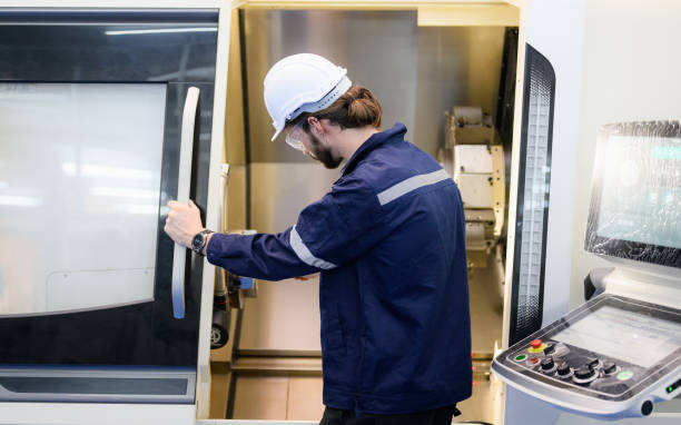 istock Professional technician checking and repairing part of automatic machine 1474138898