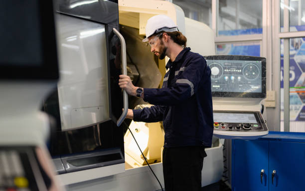 istock Professional technician checking and repairing part of automatic machine 1474138992