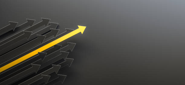 Leadership and growth concept, yellow arrow standing out from the crowd of black arrows, on black background with empty copy space on right side stock photo