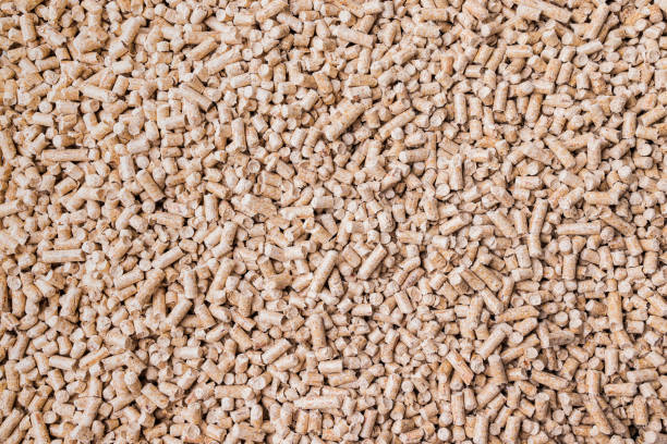 istock Wood pellets background texture. Alternative biofuel from sawdust. 1474140551