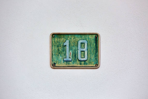 House Number 18: Address Marker on House Wall