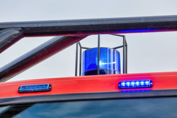 istock Blue Blinking Light on Top of Fire Truck - Emergency Services Concept 1474141766