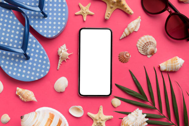 istock Flat lay composition with Phone and beach accessories on colored background. Smartphone with blank screen mock up with copy space 1474151000