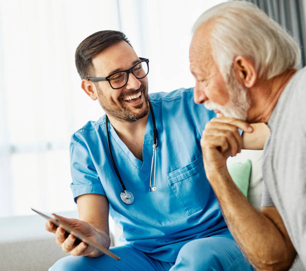 istock nurse doctor senior care tablet computer technology showing caregiver help assistence retirement home nursing elderly happy laughing man 1474151232