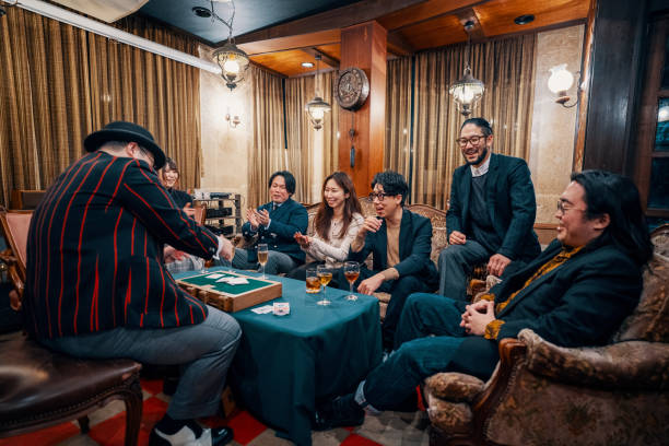 istock Magician performing a small magic show at a restaurant 1474152028