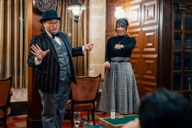 istock Magician performing a small magic show at a restaurant 1474152035