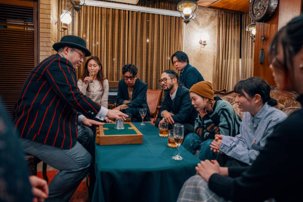 istock Magician performing a small magic show at a restaurant 1474152058